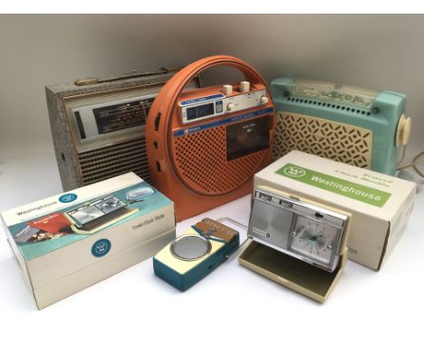A box of vintage radios including HMV, GEC and others examples.