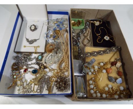 Two boxes containing a quantity of vintage costume jewellery, lighters, cufflinks, brooches, necklaces and similar also inclu