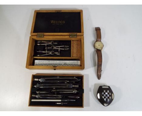 A Wedoco drawing set in wooden case, a snuff box with inlaid Mother of Pearl decoration and gentleman's wristwatch marked to 