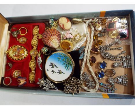 A mixed lot of vintage costume jewellery to include a Limoges set, boxed, a Stratton vintage powder compact, paired earrings,