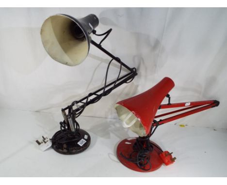 Two vintage angle-poise lamps one in red and the other in black