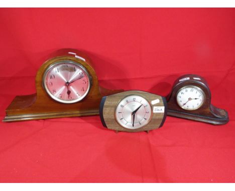 A Napoleon's hat mantel clock, Arabic numerals to a silvered dial with pendulum, a Metamec mantel clock, Arabic numerals to a