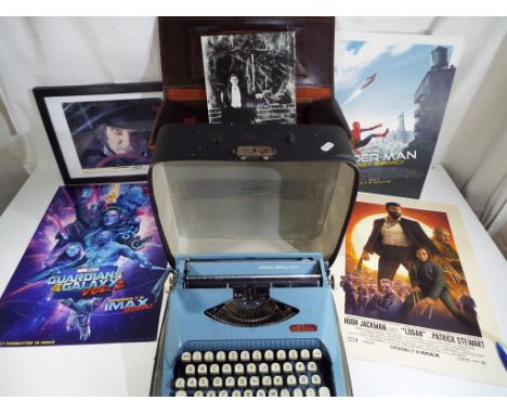 A vintage leather case containing in excess of 130 single records, a Royal Brilliant typewriter in carry case and  a small qu