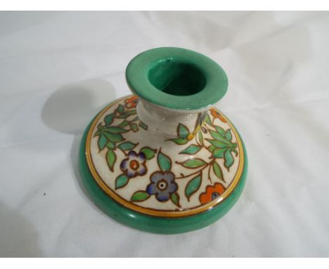 A good quality Charlotte Rhead candlestick, decorated in a floral pattern, maker's mark to the base inscribed 223. Estimate £