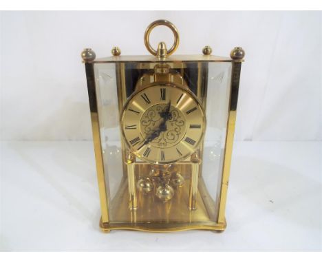 A Kundo West German mantel clock, Roman numerals to the gold coloured dial Est £15 - £20