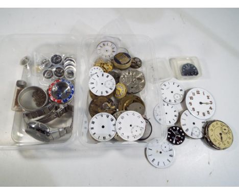 Two boxes of watch parts, faces and movements also included in the lot is a vintage Casio Wave Ceptor