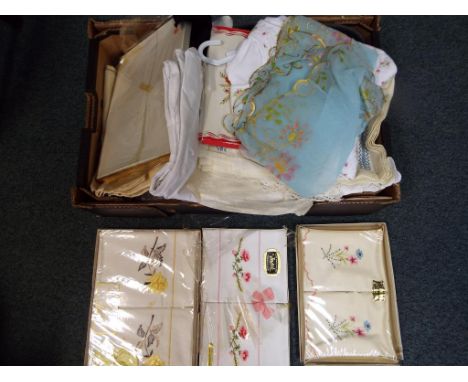 A box containing a large quantity of vintage linen