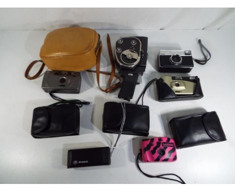A good lot to include a vintage Russian Quarz cine camera in case, a vintage Kodak Instamatic 133 camera and similar