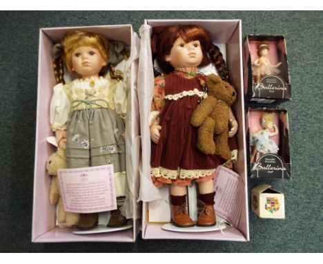 Two boxed Leonardo Collection porcelain dolls, approx 49cm (h), two further porcelain poseable ballerina dolls and a Rubik cu