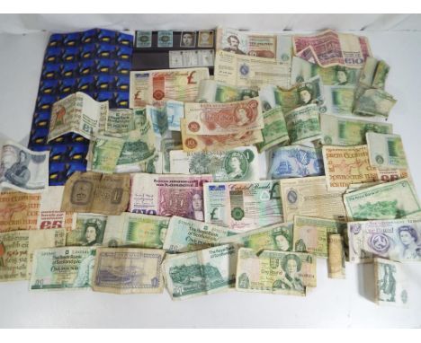 A quantity of vintage bank notes, postal orders, capital bonds and stamps