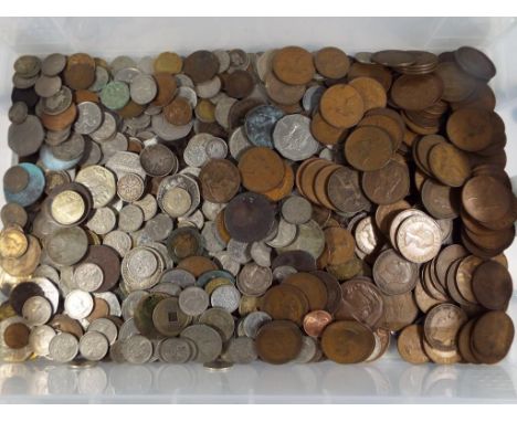 A large quantity of UK and foreign coins, pre and post decimal