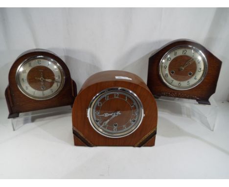 An oak cased Benting 8 day mantel clock, an oak cased Enfield mantel clock and one further mantel clock with Westminster chim