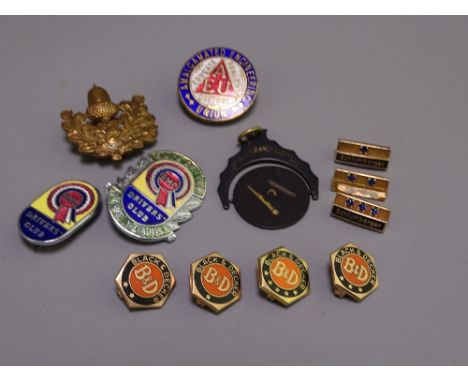 BLACK &amp; DECKER 10CT GOLD BADGES, Masonic swivel fob, 'Schlumberger' badges stamped 14K, a BMC Driver's Club five year bad