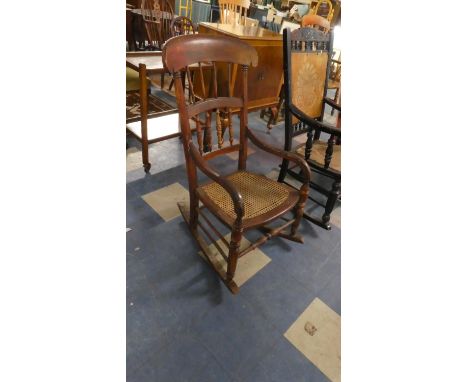 A Scumble Glazed Cane Seated Spindle Back Rocking Chair 