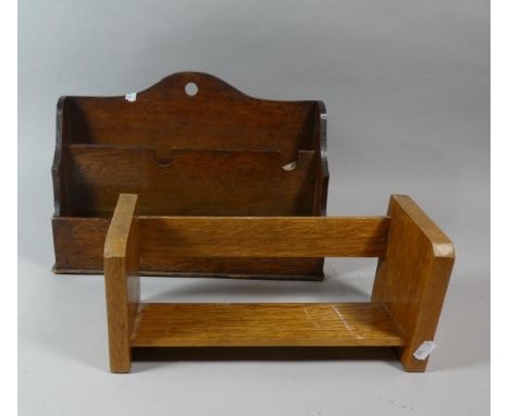 An Edwardian Oak Stationery Rack and a Book Trough 