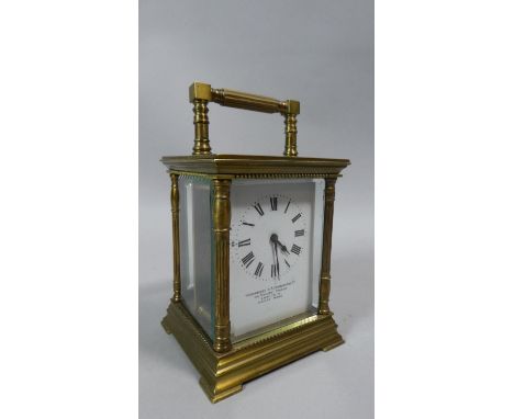 A Brass Carriage Clock with White Enamelled Dial Inscribed Goldsmiths &amp; Silversmiths Co. Regent Street London, 15cm High 