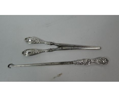 A Pair of Silver Handled Glove Stretchers and a Silver Handled Button Hook 