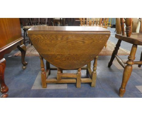 A Small Oak Drop Leaf Gate Leg Coffee Table, 59cm Long 