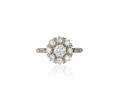 A DIAMOND CLUSTER RING, the round brilliant-cut diamond within a surround of similarly-cut diamonds, mounted in 18K gold, dia