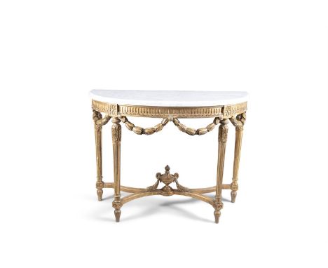 A LATE 19TH CENTURY CARVED GILTWOOD FRAMED CONSOLE TABLE, the white veined marble top with moulded rim above a fluted frieze 