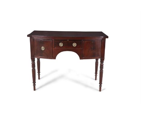 A MAHOGANY BOWFRONT SIDEBOARD, of compact proportions, fitted centre drawer flanked by two deep drawers with brass ring handl