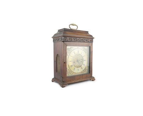 A COMPOSED MAHOGANY CASED BRACKET CLOCK, with flat domed top, fitted brass carrying handle, above a blind fret frieze and gla