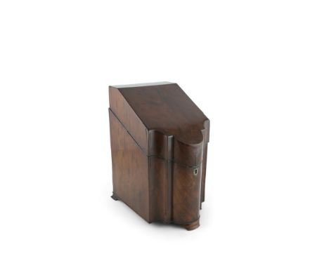 A GEORGIAN MAHOGANY KNIFE BOX, the sloped hinged lid enclosing a fitted interior, with shaped panel front and raised on brack