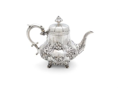 A VICTORIAN SILVER TEAPOT, London 1846, mark of Emma Dear, of lobed squashed pear form, with scroll handle and artichoke fini