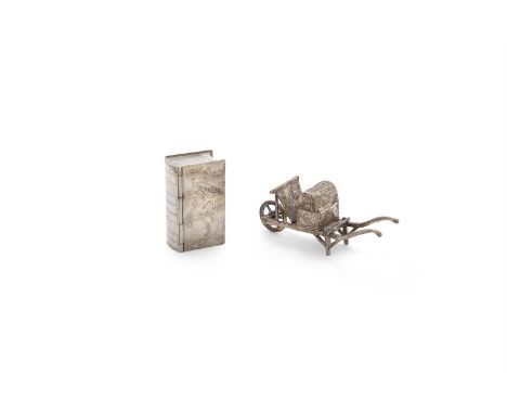 A DUTCH WHITE METAL NOVELTY TRINKET BOX IN THE FORM OF A BOOK, stamped 800 standard. 5.5cm long; together with a white metal 