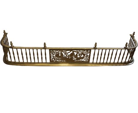 AN IRISH GEORGE IV PIERCED BRASS GALLERY FENDER, the central panel decorated with the triumph of Neptune