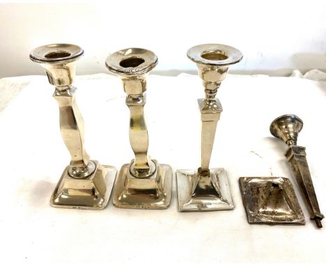 Selection of 4 silver candle stick holders, all filled, one has damage 