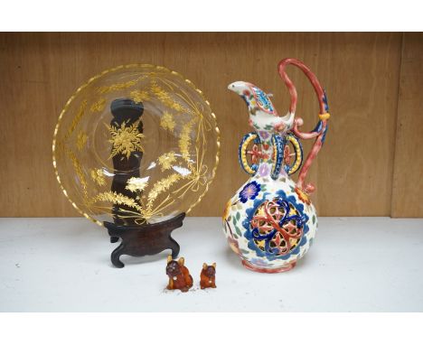 A Bohemian gilded glass bowl on stand in Zsolnay type cover and two French miniature glass dogs with pearl decorated collars,