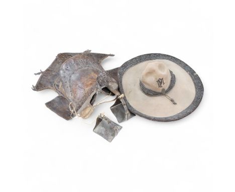 A Spanish Colonial leather saddle and a Spanish Colonial bullion work sombrero, saddle 59cm long