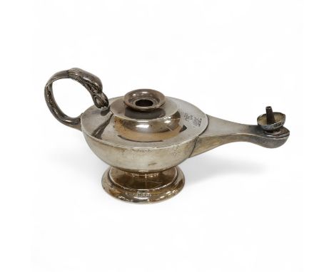 A George V Asprey &amp; Co silver table lighter, modelled as an 'Aladdin' oil lamp, Birmingham, 1911, length 16cm, weighted.