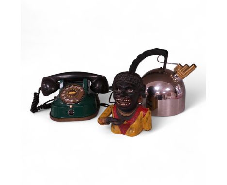 An Alessi 9091 kettle by Richard Sapper, an FTR green telephone and a painted cast iron mechanical money box. (3). Alessi ket