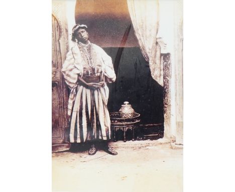 A set of four black and white photographs, Orientalist scenes to include pottery painting and a woman at a loom,, 29 x 19cm, 