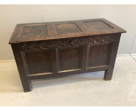 A late 17th century oak coffer with triple panel top, width 102cm, depth 50cm, height 165cm