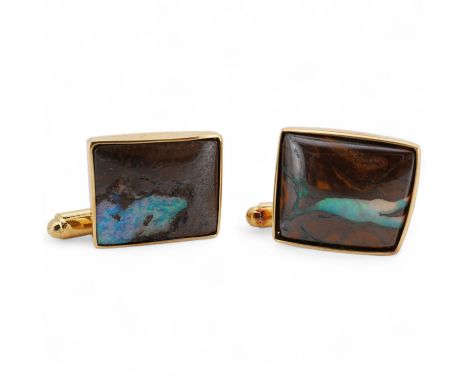 A modern pair of 18ct gold and opal set cufflinks by Geoffrey Turk Ltd, London, 13.5mm by 11mm, gross weight 7.8 grams, with 