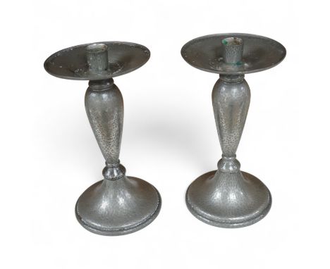 A pair of Liberty Tudric pewter candlesticks, numbered 01223 to the bases, 24cm high