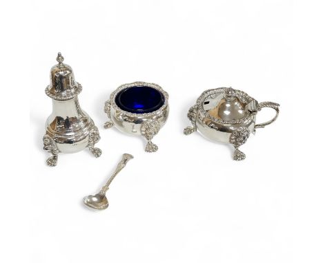 A George VI silver three piece condiment set by Mappin &amp; Webb, London, 1937, with blue glass liners, one associated, pepp