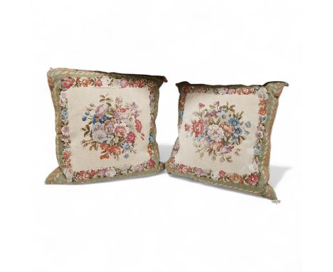 A large pair of 20th century Aubusson floral tapestry cushions. Woven with a central cartouche of roses and garden flowers wi
