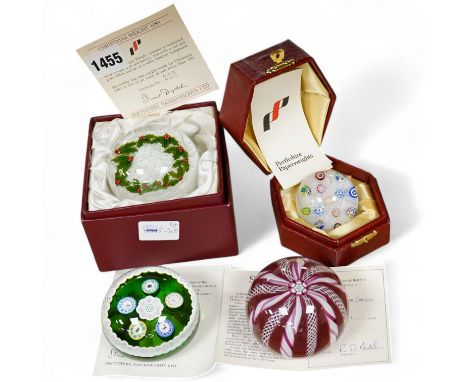 Two Perthshire glass Christmas paperweights for 1981 and 1983, a Perthshire miniature Latticino weight, 18/400 and a Selkirk 