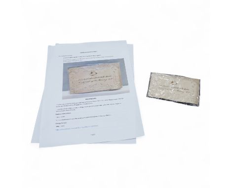 A lock of Lord Byron's hair mounted on an early 19th century embossed card decorated with classical figures, 11.3 x 7.5cm, st
