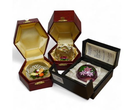 Two Perthshire lamp work glass paperweights, fruit weight, 52/350, rose and bud weight, 69/300 together with a John Deacon bo