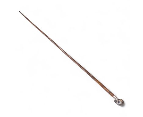 A 19th century bamboo walking stick with memento mori skull finial, the skull with articulated jaw, 84cm in length
