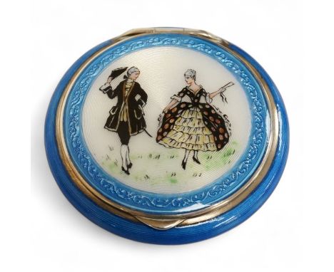 A George V silver and enamelled circular compact, the cover depicting a lady and gentleman, import marked for P.H. Vogel &amp