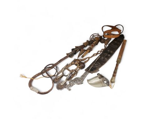 A group of Argentinian Gaucho spurs, bolas, bull whip, daggers and hanger, Longest 100cm