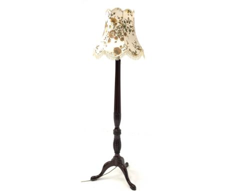 20th century mahogany standard lamp, with leaf carved and reeded column over triple splayed supports, H158cm (Excluding shade