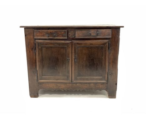 19th century French oak sideboard, with two drawers over two panelled doors enclosing shelf, shaped apron, stile supports, W1