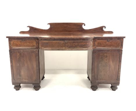  William IV mahogany break bow front sideboard, with raised back over three drawers and two panelled cupboards enclosing shel